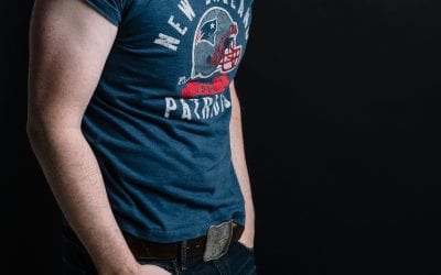 Photograph of a man with a New England Patriots T-shirt.