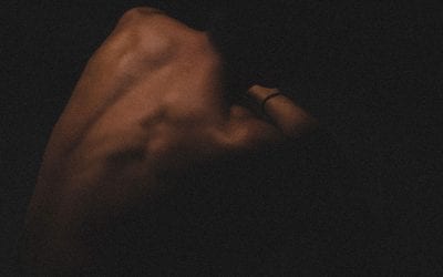 Artful photograph of a man's bare back.